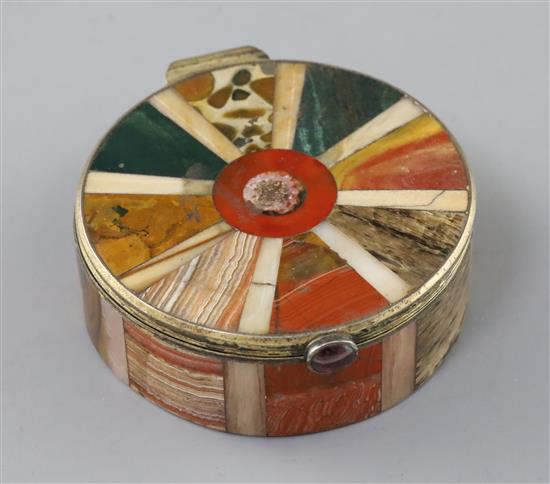 A 19th century continental silver gilt and multi hardstone segmented circular snuff box and cover, 7cm.